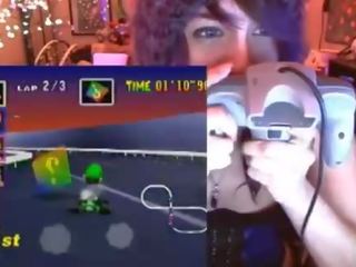 Geek teenager cums playing Mario Kart