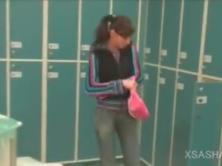 Lesbo hot to trot Brunette Masturbates Cunt In The Locker Room