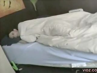 Dark haired chick uses vibrator to fall asleep